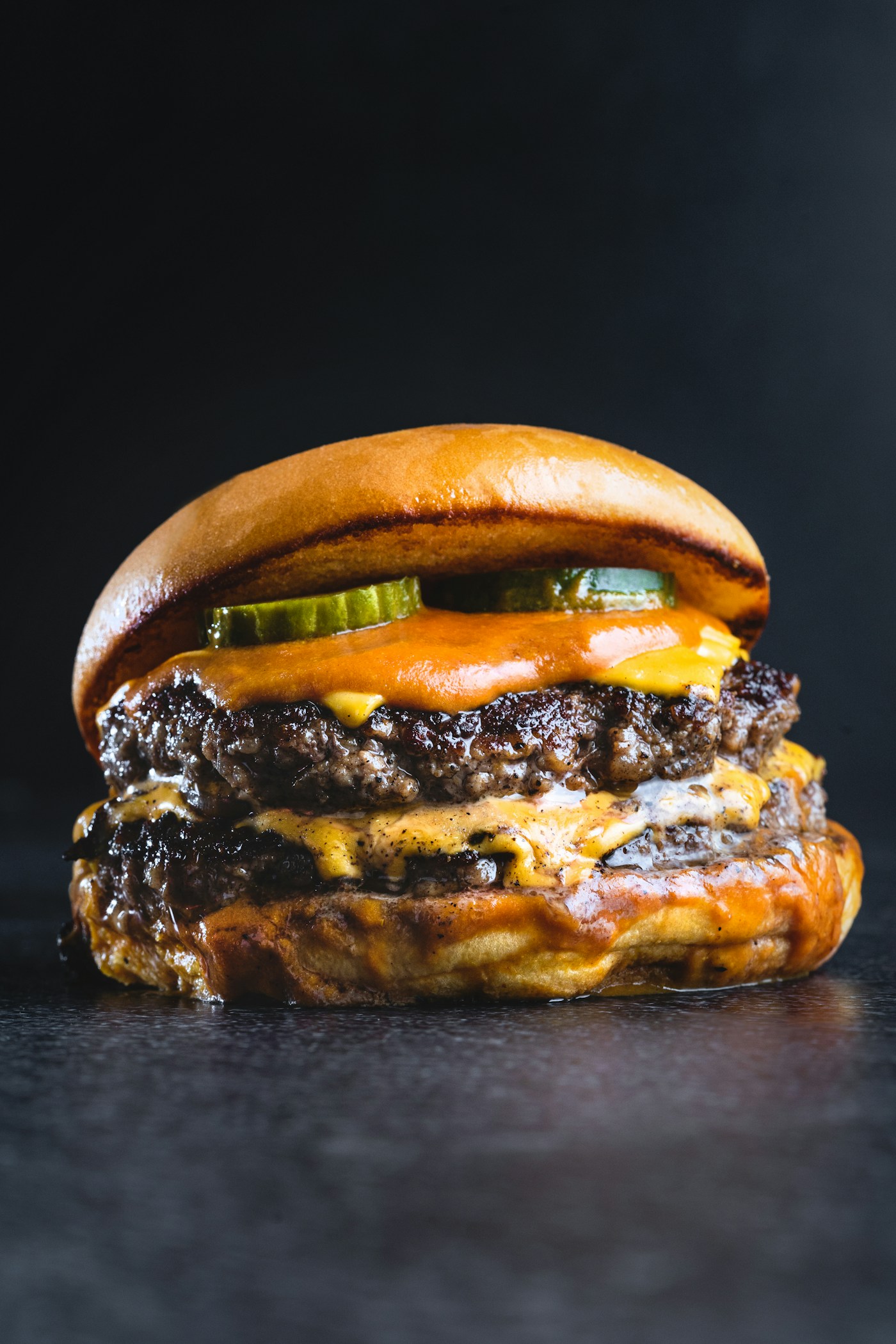 Illustrative food photograph of a double cheeseburger